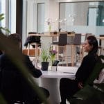 Flexible and hybrid workspace design with modular seating and collaborative areas promoting productivity.