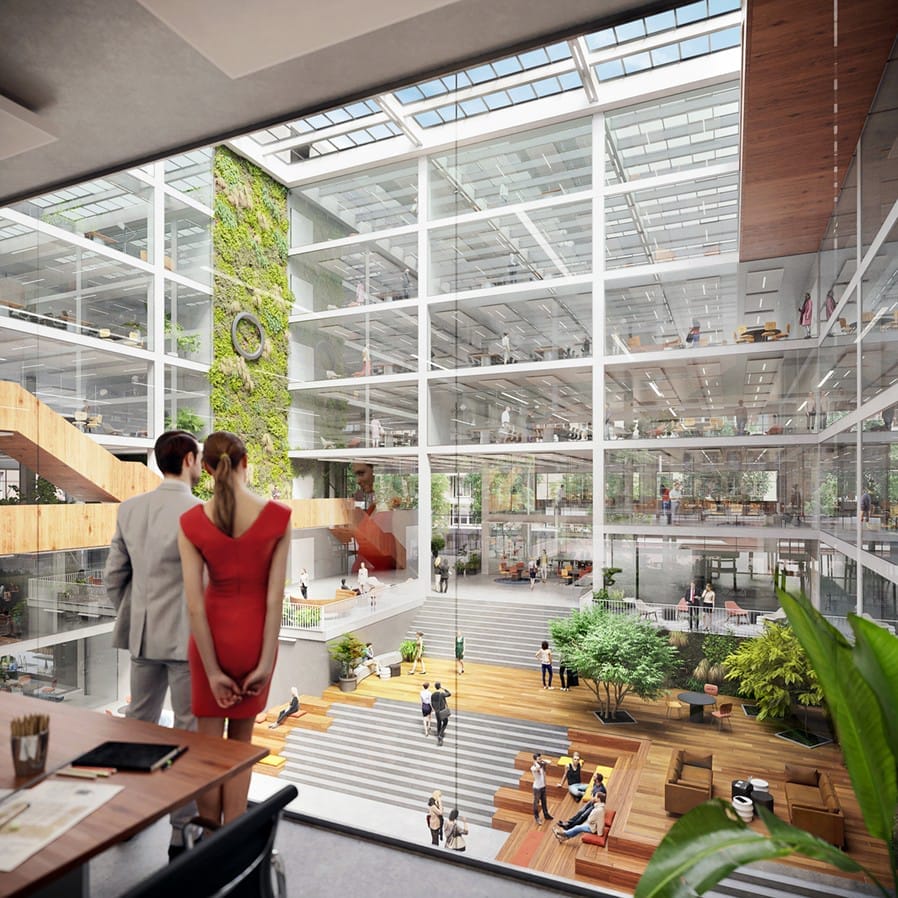 A modern office atrium filled with natural light, featuring a vertical green wall, glass walls, wooden balconies, and various seating areas. People casually interact and work in this vibrant, plant-filled space An image from EDGE Workspaces.