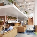Moderne Bürolobby mit bequemen Sitzgelegenheiten, eigenem Arbeitsbereich, Grünpflanzen, einer Holztreppe und großen Fenstern, die für reichlich natürliches Licht sorgen. Menschen unterschiedlichen Geschlechts treffen sich und arbeiten an Laptops. An image from EDGE Workspaces.