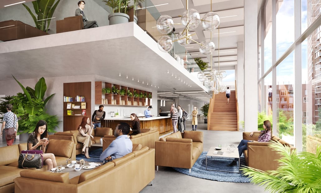 A spacious, modern lobby with a mezzanine. People relax and chat on sofas and in a dedicated workspace. Large windows, indoor plants, and stylish globe lights enhance the open, airy atmosphere. An image from EDGE Workspaces.
